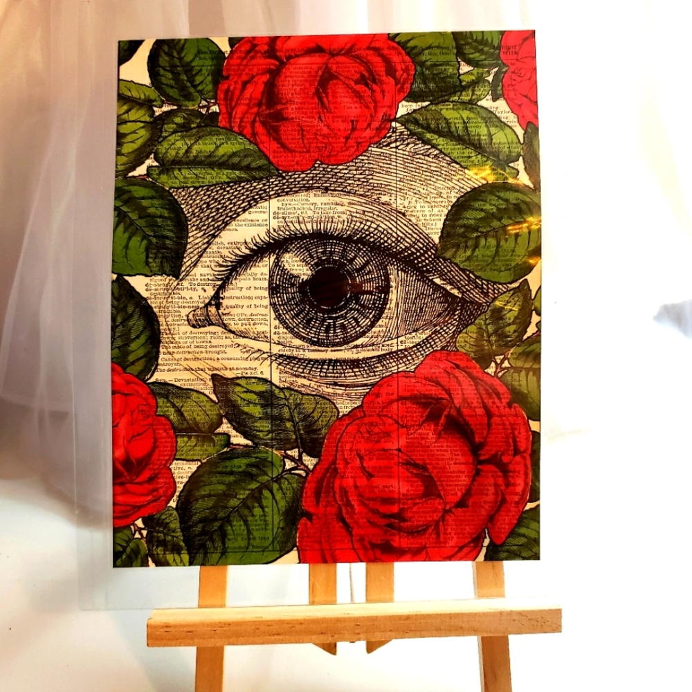 Artwork on vintage dictionary page with easel.